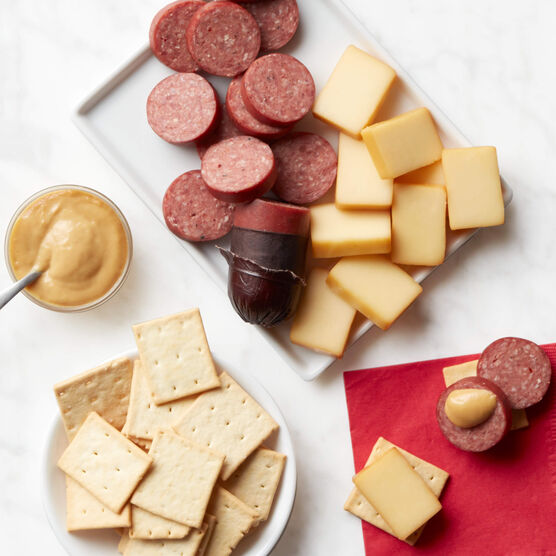 Signature Beef Sampler Gift Box meat and cheese sliced and arranged on tray